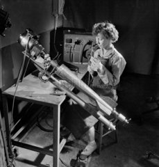 A Female worker making bomb casings  Leeds  1953.