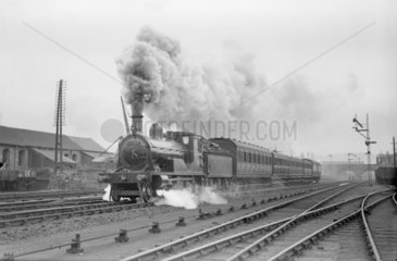 Caledonian Railway steam locomotive and passenger train