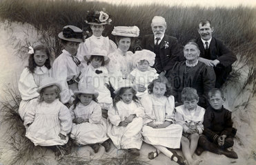 Family group in the sand dunes  late 19th-early 20th century.