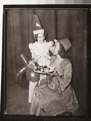 Vera Lynn offering Hester Goldstein a piece of cake  1949.