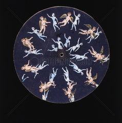 Phenakistoscope disc showing a cupid and two girls  c 1830.