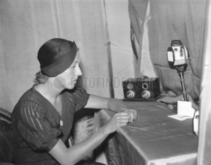Amy Johnson making a broadcast from her hotel room  18 December 1932.