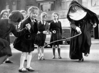 A nun teaching her pupils to skip  27 October 1959.