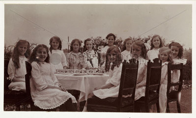 Girls' tea party  c 1910.