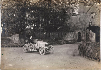 Motor car outside a country house  c 1912.