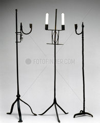Three floor-standing candlesticks  c 18th century.