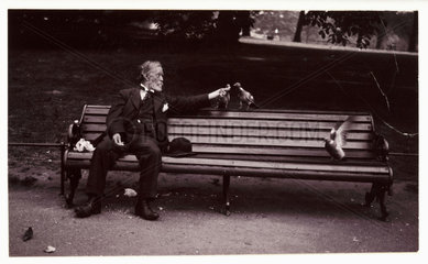 Man on a park bench  c 1920