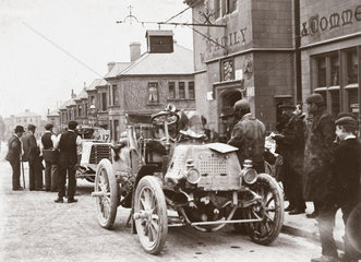 Motor car parked in a street during the 1000 Mile Trial  1900.