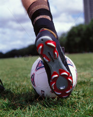 A football boot about to strike a ball  October 2000.