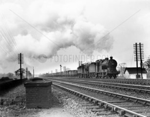 Two Class 4F 0-6-0 steam locomotives head a coal train  c 1930s.