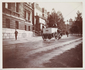 Cart spraying water  c 1912.