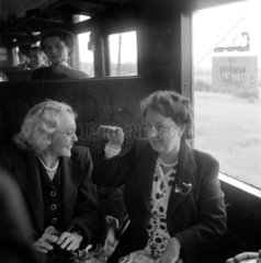 Women talking during a train journey  1950.