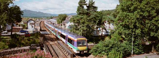 Passenger train on the Highland Main line  Scotland  2002.