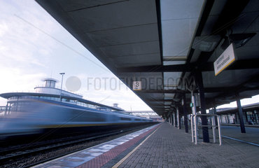 A Eurostar train going by Ashford Internationals Station.