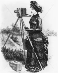 Lady with field camera on location  c 1890.