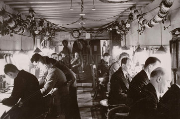 Railway workers in a control room on the Southern Railway  Christmas 1940.