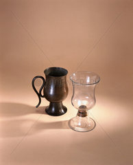 Copper syphon or ‘Tantalus’ cup  and glass  early 18th century.