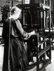 Woman weaving cotton on a hand loom in a cotton mill  c 1890s.