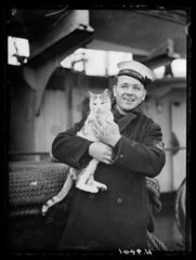 Sailor with ship's cat  15 February 1940.