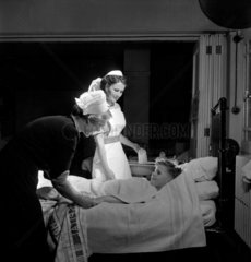 Trainee nurse gives patient blanket bath  Royal Free Hospital  1952.