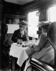 Female passengers in a LNWR dining carriage  c 1905.