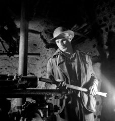 A young tin and copper miner working underground  Cornwall  1948.