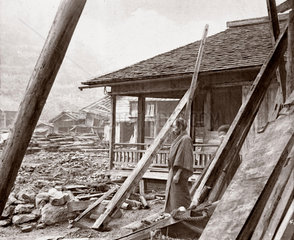 Devastated houses following an earthquake  Japan  1876.