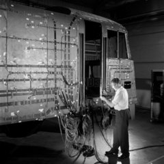Engineers conduct stress analysis on railway loco body in shed.