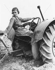 Land girl learning to plough using a tractor  7 May 1939.