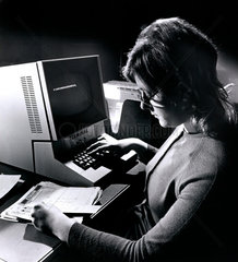 Littlewoods Pools: a female operator inputting at terminal 3 desk  1970.