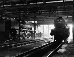 Two Pacific 4-6-2 express locomotives in Polmadie engine shed  18 July 1961.