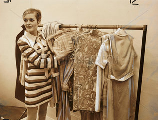 Twiggy with rail of 'Twiggy Clothes'  1967.