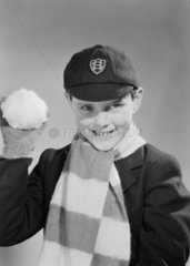 Boy throwing a snowball  c 1955.