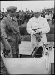 E G Burggaller and mechanic  German Grand Prix  Nurburgring  1934.