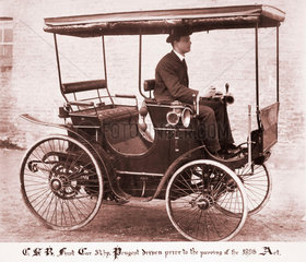 C S Rolls  driving his first car  1896.