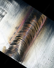 Piece of steel showing a friction stir weld join  2000.