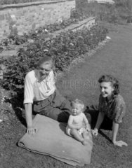 Young family in a garden  1948.