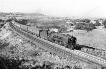 Steam locomotive with a passenger train  near Karee  South Africa  1968.