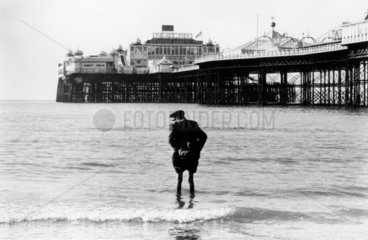 Elderly man paddling at Brighton  1967.