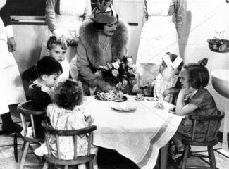 Queen Elizabeth visiting children in hospital  London  13 October 1938.