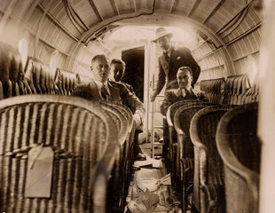 Four men in the passenger cabin of a Supermarine 'Swan' flying-boat  c 1924.