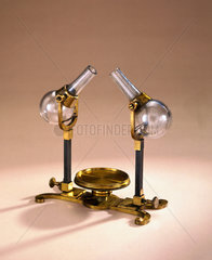Brass stand with two tilting glass flasks  1761.
