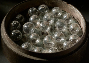 21 spirit bubbles  in circular case  c 1840-1920.