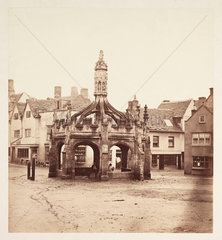 Market cross in a village square  Sussex  c 1860.