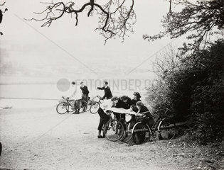 Cyclists studying maps  15 April 1938.