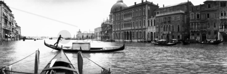 Gondolas on a Venetian canal  c 1900s.