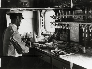 Preparing lunch on the Imperial Airways aeroplane 'Scylla'  19 November 1936.