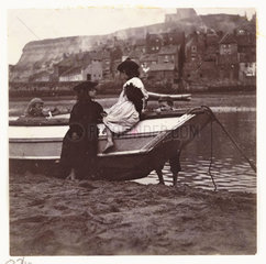 Children playing by the stern of a boat  Whitby Harbour  North Yorkshire  c 1905.
