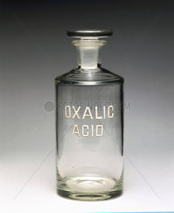 Clear glass reagent bottle labelled ‘OXALIC ACID’  1940.