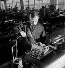 Greasing typewriters  Leicester  1951.
